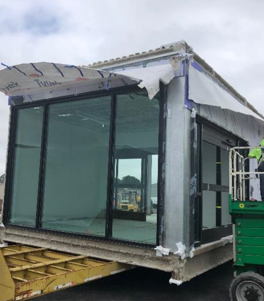 Module being prepared and loaded on truck bed for shipping to the site. 